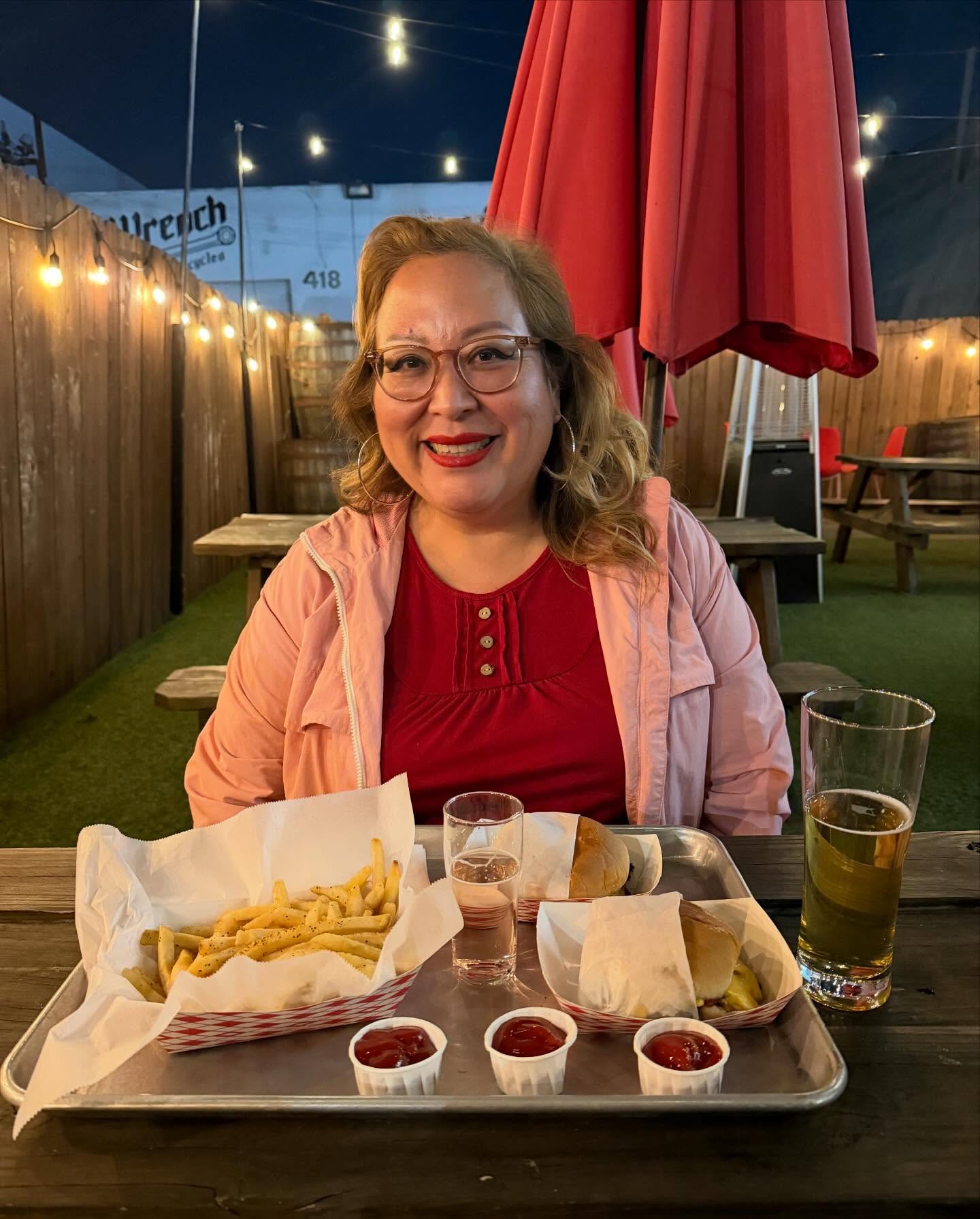 Customer review — full meal of fries, burgers, sauces and a beer at Paperback Brewing patio